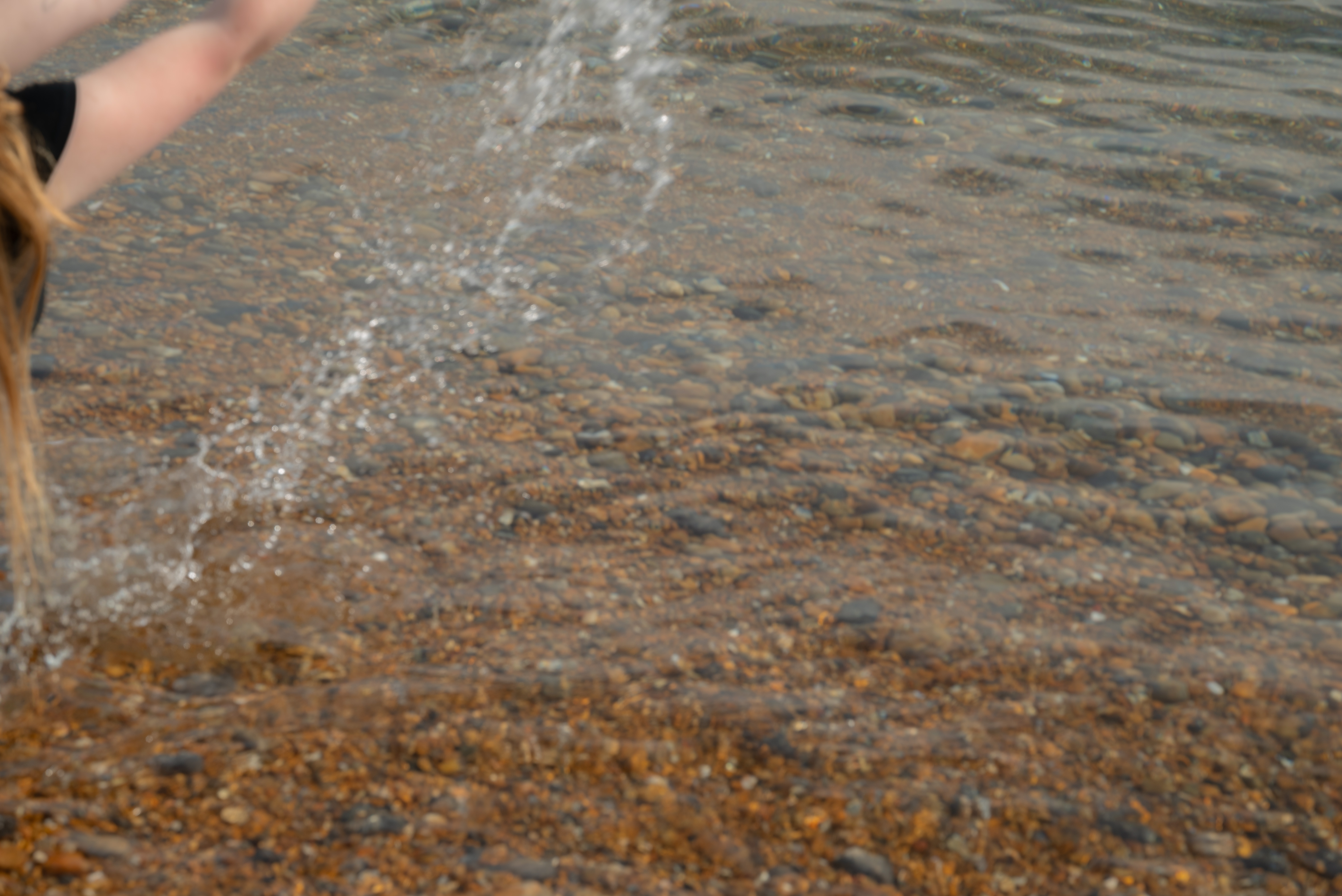 splash: someone's hands splashing water up in the air